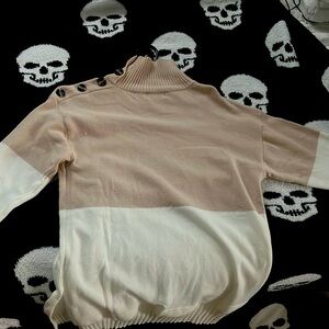 Soft cashmere sweater with buttons along neckline! Never worn. Mint condition.